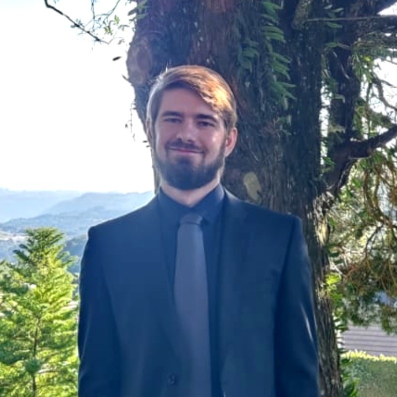 Arthur Hoch wearing a dark suit outdoors, framed as the portrait for this portfolio.